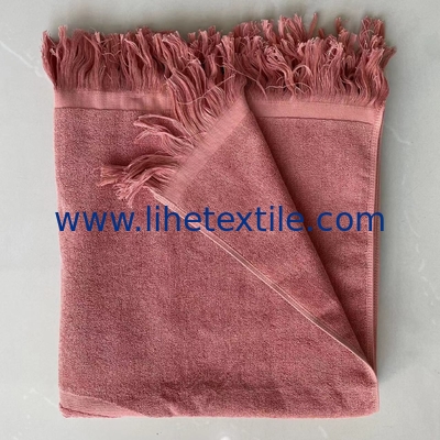 OEM custom luxury 100% cotton plain embossed  logo design beach towel with tassel